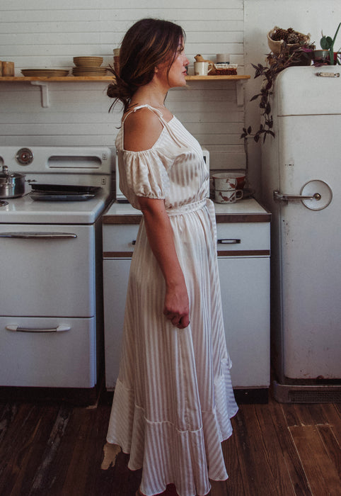 Christie Araujo Idylwild Vintage feminine Asymmetrical hem ruffle dress w off the shoulder puff sleeves