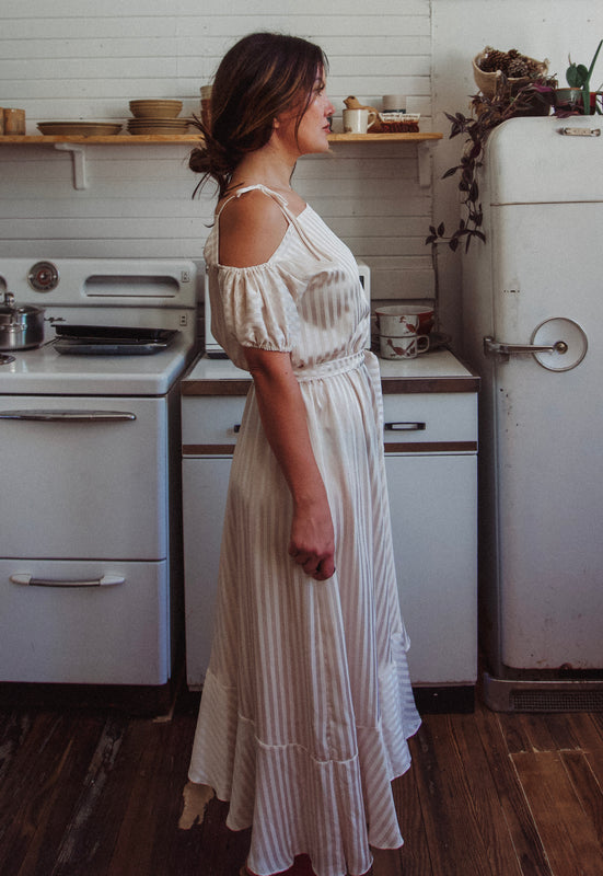 Christie Araujo Idylwild Vintage feminine Asymmetrical hem ruffle dress w off the shoulder puff sleeves