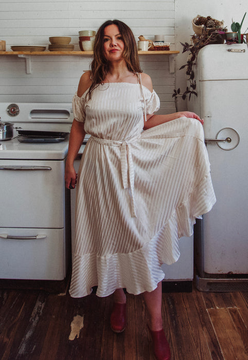 Christie Araujo Idylwild Vintage feminine Asymmetrical hem ruffle dress w off the shoulder puff sleeves