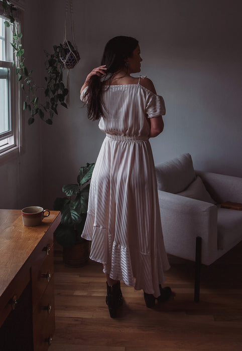 Idylwild Vintage feminine Asymmetrical hem ruffle dress w off the shoulder puff sleeves Christie Araujo
