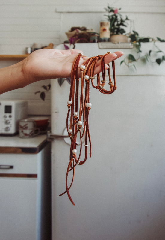 Christie Araujo Bridle Necklace Idylwild Jewelry Freshwater Pearls and Deerskin Leather Lacing